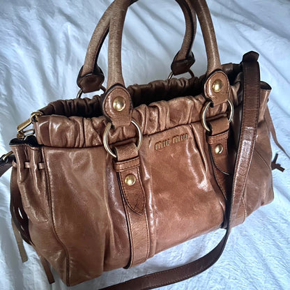 Authentic Brown Miu Miu Vitello Leather Bag With Gold Hardware And Removable Strap