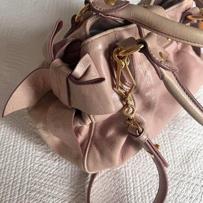 Authentic Light Pink Miu Miu Vitello Leather Bow Bag With Gold Hardware And Removable Strap